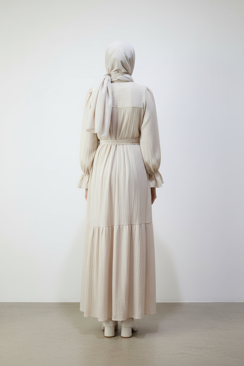 Cream dress back view on concrete floor